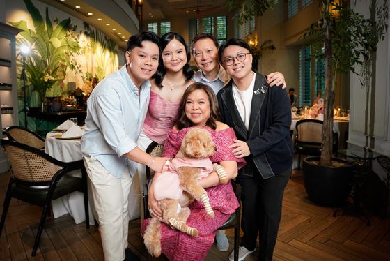 A family gathered together at a birthday celebration