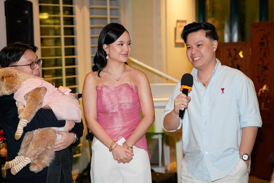A guest giving a toast into a microphone